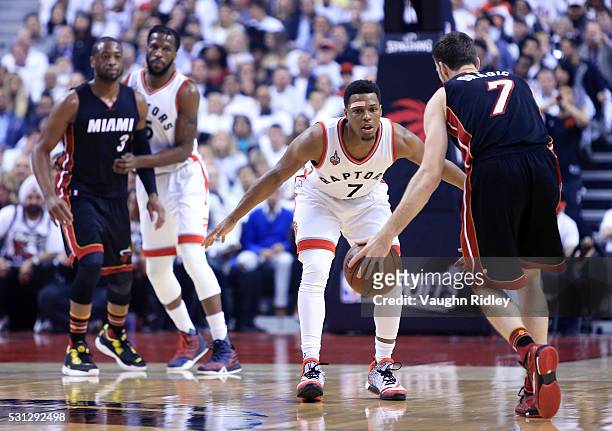 Kyle Lowry of the Toronto Raptors defends as Goran Dragic of the Miami Heat dribbles the ball in the first half of Game Five of the Eastern...