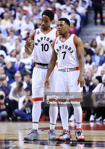 DeMar DeRozan and Kyle Lowry of the Toronto Raptors talk in the first half of Game Five of the Eastern Conference Semifinals against the Miami Heat...