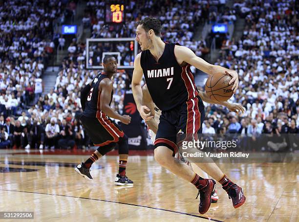 Goran Dragic of the Miami Heat dribbles the ball in the second half of Game Five of the Eastern Conference Semifinals against the Toronto Raptors...