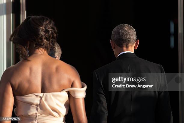 First Lady Michelle Obama and U.S. President Barack Obama head inside after greeting leaders during arrivals for the Nordic state dinner on the North...