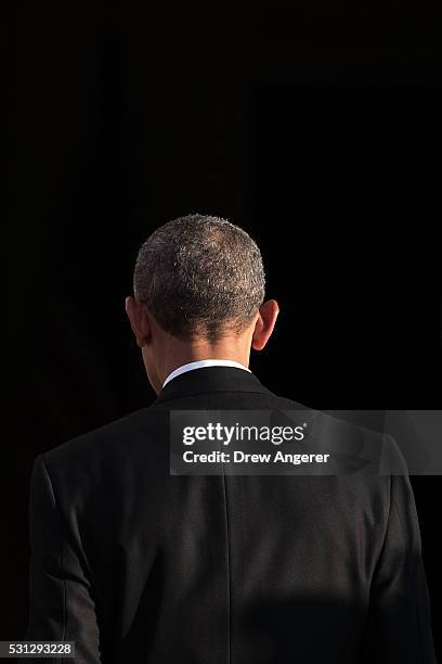 President Barack Obama walks inside after greeting leaders during arrivals for the Nordic state dinner on the North Portico at the White House, May...