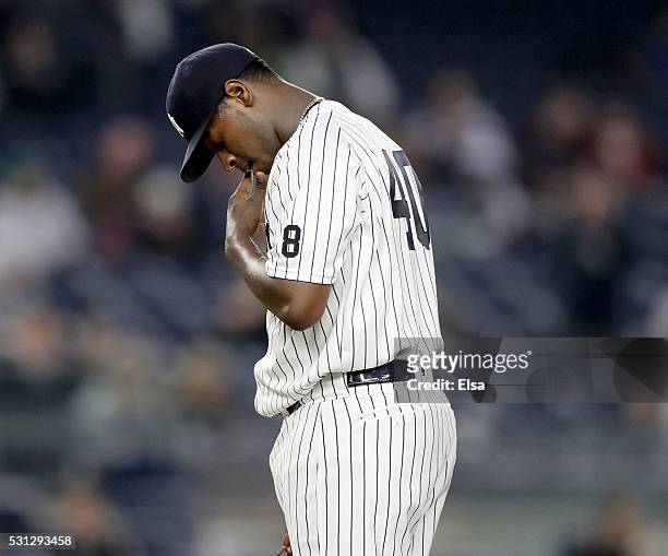 Luis Severino of the New York Yankees reacts in the third inning against the Chicago White Sox at Yankee Stadium on May 13, 2016 in the Bronx borough...