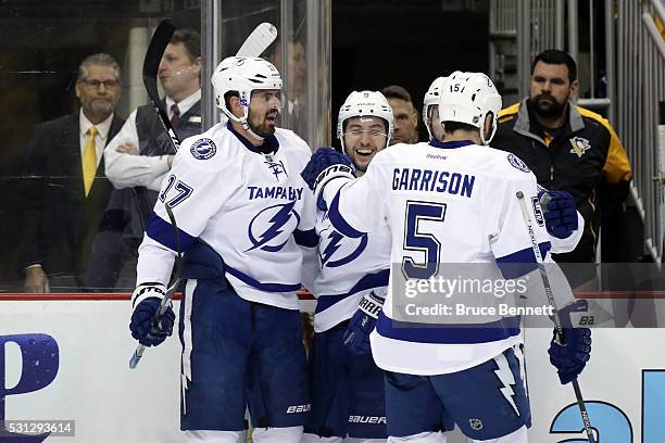 Alex Killorn of the Tampa Bay Lightning celebrates with his teammates Tyler Johnson, Nikita Kucherov and Jason Garrison after scoring a goal late in...