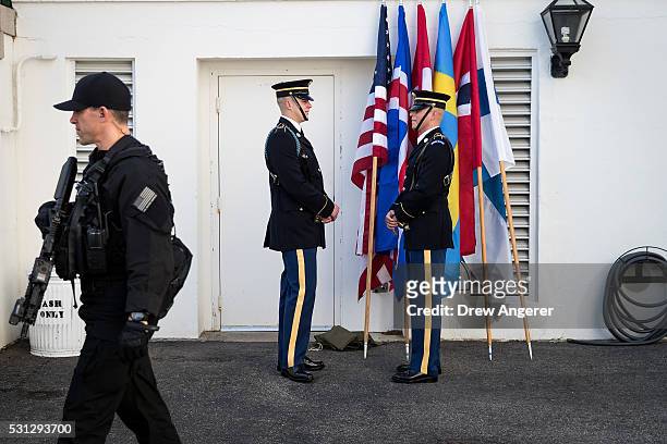 Member of the U.S. Secret Service walks past members of the Honor Guard before the arrival of leaders for the Nordic state dinner at the White House,...