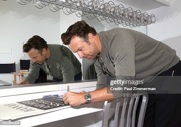 Actor Jason Sudeikis signs a poster backstage at the Film Independent Presents Live Read Of "Hannah And Her Sisters" at Times Center on May 13, 2016...