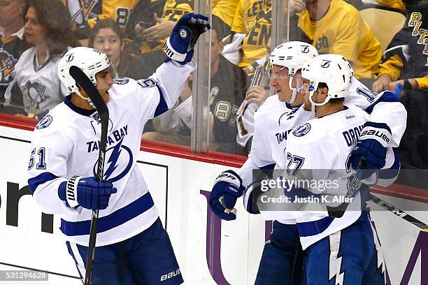 Jonathan Drouin of the Tampa Bay Lightning celebrates with his teammates after scoring a goal in the second period against Matt Murray of the...