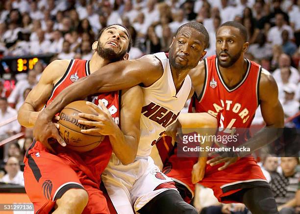 Patrick Patterson watches as teammate Cory Joseph of the Toronto Raptors has the ball taken by Dwyane Wade of the Miami Heat during Game 6 of the...