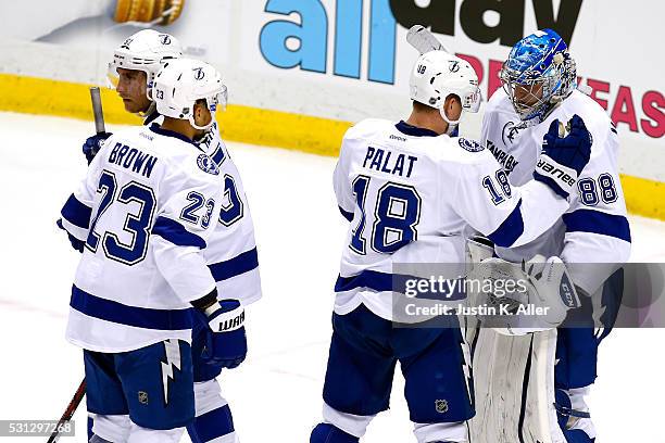 Andrei Vasilevskiy of the Tampa Bay Lightning celebrates with teammate Ondrej Palat after defeating the Pittsburgh Penguins in Game One of the...