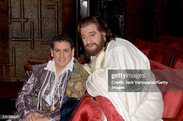 Peruvian tenor Juan Diego Florez and Spanish tenor Placido Domingo sit together during a break on the first of two days of final dress rehearsals for...