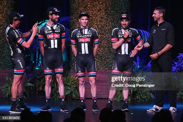 John Degenkold of Germany and Team Giant - Alpecin is interviewed by Jens Voigt as a teammate takes a photo during the team presentation at Sea World...