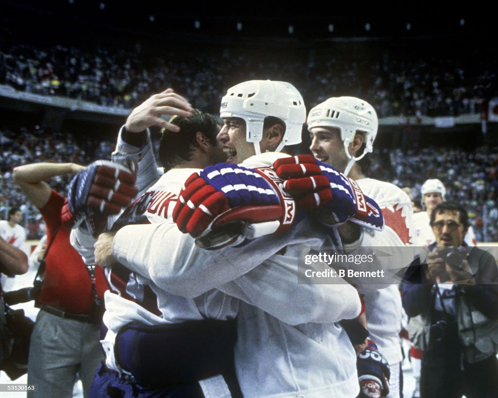Mark Messier hugs Dale Hawerchuk...