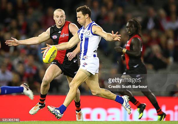 Brent Harvey of the Kangaroos kicks the ball during the round eight AFL match between the Essendon Bombers and the North Melbourne Kangaroos at...