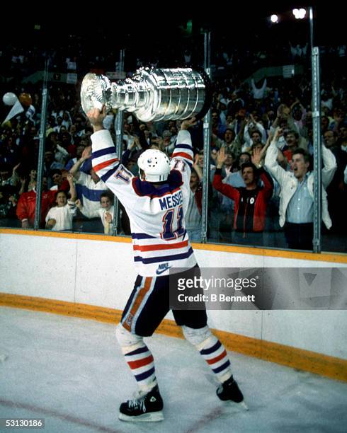 Mark Messier of the Edmonton Oilers skates around the rink celebrating with the crowd after the Oilers Game 7 win over the Philadelphia Flyers on May...