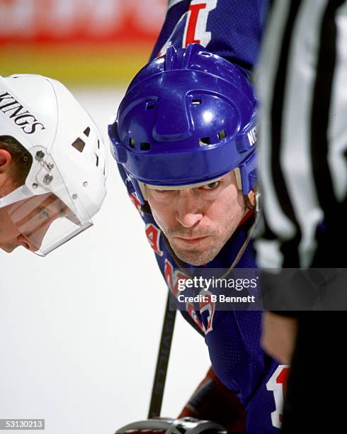 Mark Messier faces off against Jari Kurri.