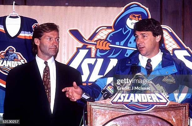 General manager Don Maloney of the New York Islander introduces new head coach Mike Milbury during a press conference on July 5, 1995 at the Nassau...