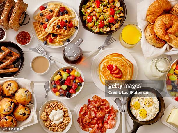 breakfast feast - breakfast table stock pictures, royalty-free photos & images