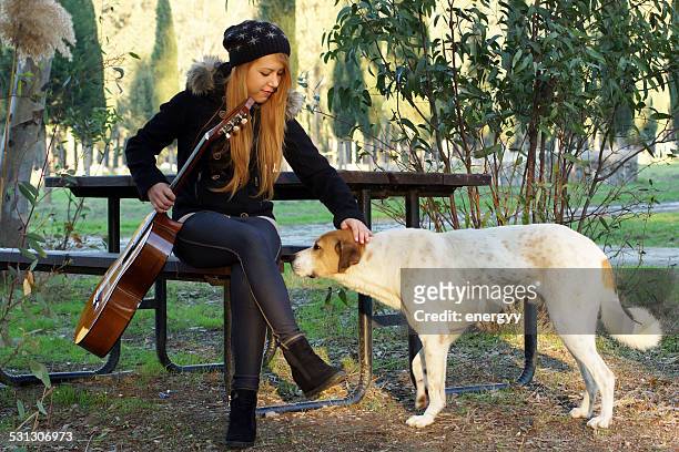 young women with guitar - dog number 2 stock pictures, royalty-free photos & images