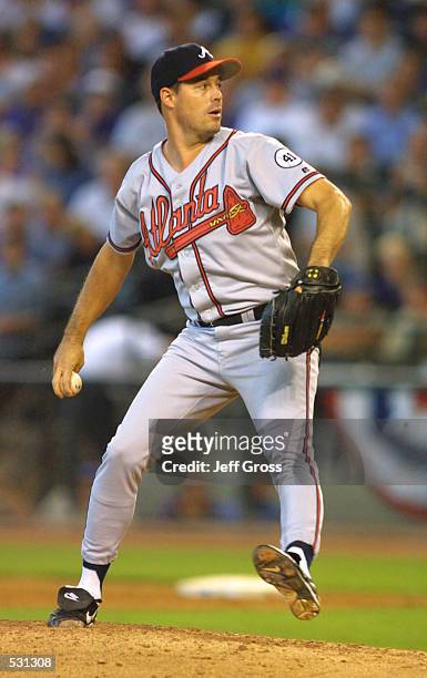 Pitcher Greg Maddux of the Atlanta Braves throws a pitch during game one of the National League Championship Series against the Arizona Diamondbacks...
