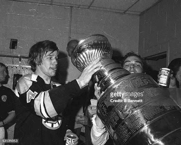 Bobby Orr of the Boston Bruins drinks from the Stanley Cup after Boston defeated the New York Rangers in Game 6 of the 1972 Stanley Cup Finals on May...