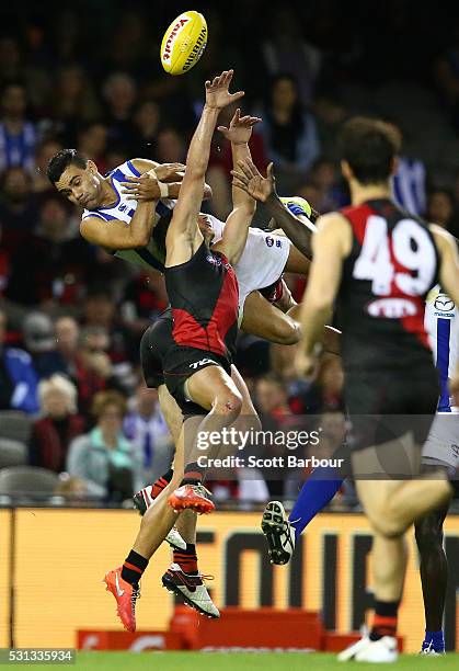 Lindsay Thomas of the Kangaroos attempts to take a spectacular mark during the round eight AFL match between the Essendon Bombers and the North...