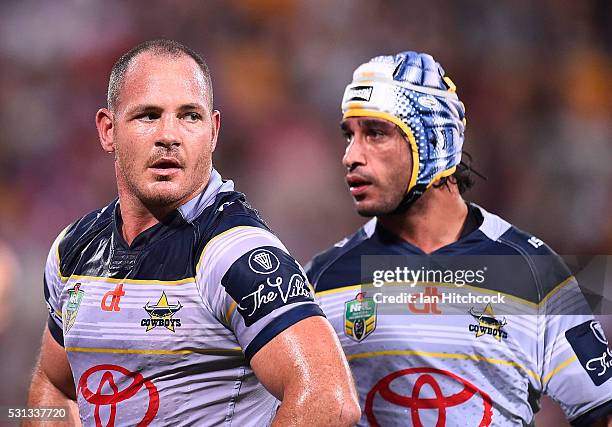 Matthew Scott and Johnathan Thurston of the Cowboys look on during the round 10 NRL match between the Melbourne Storm and the North Queensland...