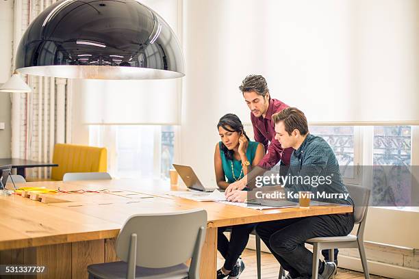 modern office shoot - group office laptop stock pictures, royalty-free photos & images