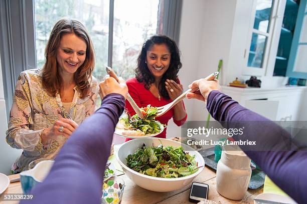 woman serving salad from first person perspective - personal perspective or pov stockfoto's en -beelden