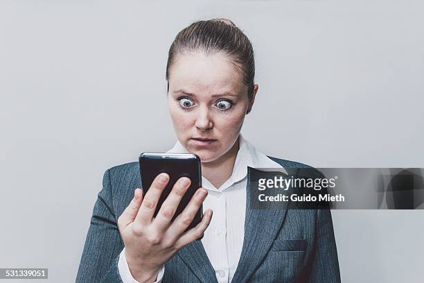 businesswoman looking surprised. - bad news stock pictures, royalty-free photos & images