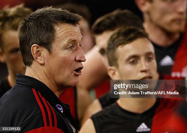 John Worsfold, Senior Coach of the Bombers addresses his players during the 2016 AFL Round 08 match between the Essendon Bombers and the North...