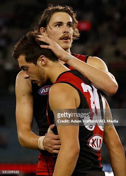 Joe Daniher of the Bombers consoles Kyle Langford of the Bombers after a loss during the 2016 AFL Round 08 match between the Essendon Bombers and the...