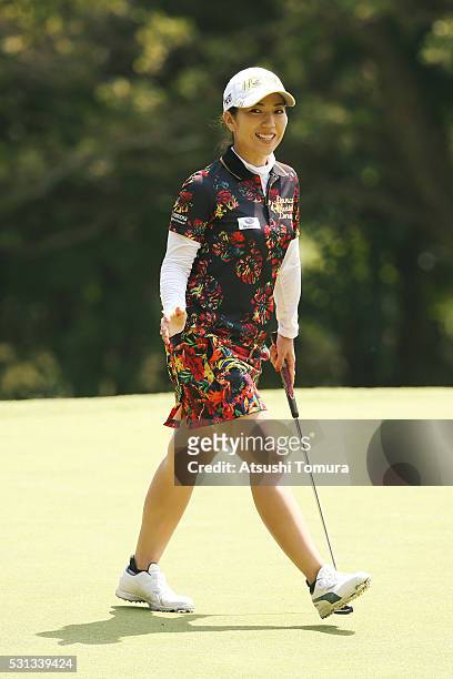 Ritsuko Ryu of Japan smiles after making her birdie putt on the 14th green during the second round of the Hoken-no-Madoguchi Ladies at the Fukuoka...