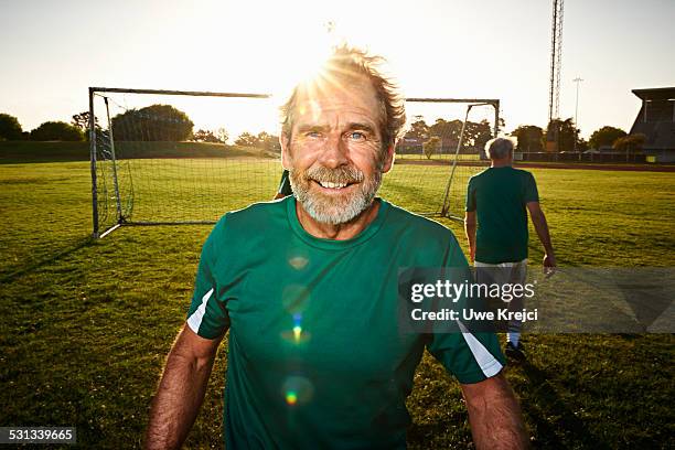 portrait of mature soccer player - lagsportsuniform bildbanksfoton och bilder