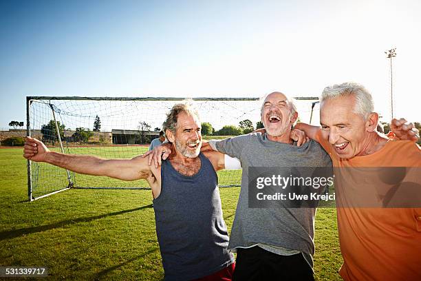 mature soccer players cheering - 60 65 man stock pictures, royalty-free photos & images