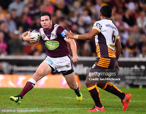 Jamie Lyon of the Sea Eagles looks to get past Anthony Milford of the Broncos during the round 10 NRL match between the Manly Sea Eagles and the...