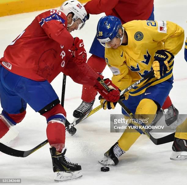 Norway's defender Ole-Kristian Tollefsen vies with Sweden's forward Johan Sundstrom during the group A preliminary round game Norway vs Sweden at the...