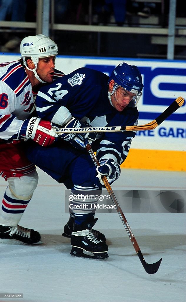 Randy Ranger Toronto's Randy Wood tries to escape the grasp of Ranger Doug Lidster ...