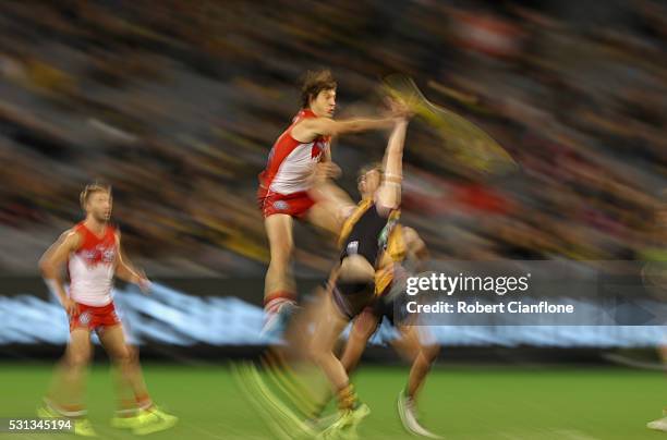 Kurt Tippett of the Swans and Tyrone Vickery of the Tigers compete for the ball during the round eight AFL match between the Richmond Tigers and the...