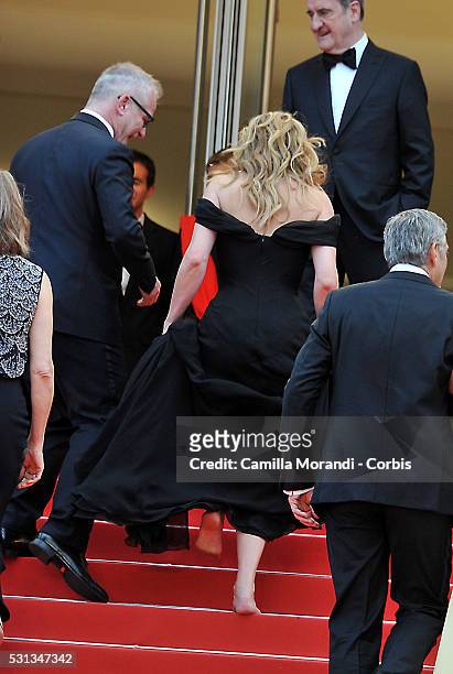 Julia Roberts walks bare foot as she attends 'Money Monster' Red carpet prior to the 69th annual Cannes Film Festival on May 10, 2016 in Cannes,...