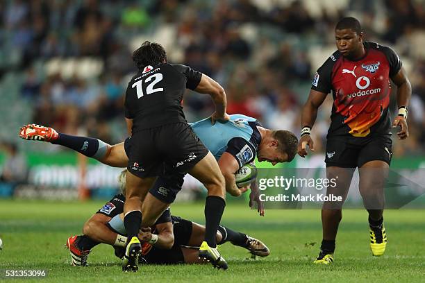 Paddy Ryan of the Waratahs is tackled during the round 12 Super Rugby match between the Waratahs and the Bulls at Allianz Stadium on May 14, 2016 in...