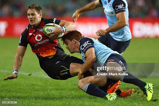 Marais of the Bulls is tackled by Andrew Kellaway of the Waratahs during the round 12 Super Rugby match between the Waratahs and the Bulls at Allianz...