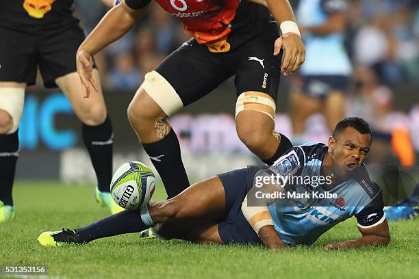 Kurtley Beale of the Waratahs reacts after injuring himself during the round 12 Super Rugby match between the Waratahs and the Bulls at Allianz...