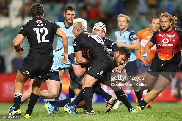 Angus Ta'avao of the Waratahs drives towards the line to score a try during the round 12 Super Rugby match between the Waratahs and the Bulls at...