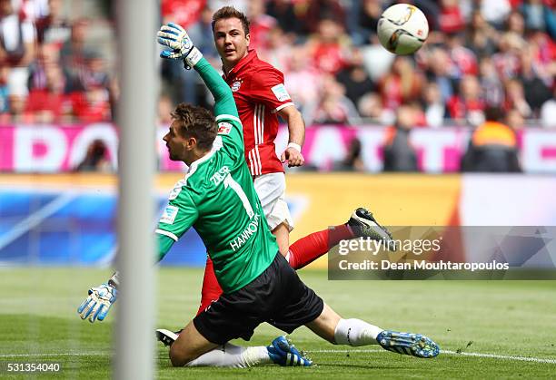 Mario Goetze of Bayern Muenchen scores his team's second goal past Ron-Robert Zieler of Hannover 96 during the Bundesliga match between FC Bayern...