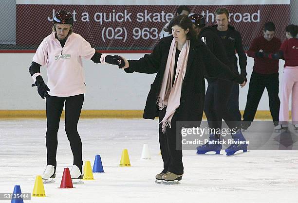 Beauty Queen Belinda Green is assisted by Monica Aubrecht during a training session in preparation for the new TV series "Skating On Thin Ice" at the...