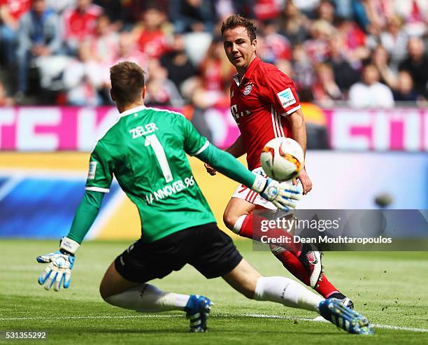 Mario Goetze of Bayern Muenchen scores his team's second goal past Ron-Robert Zieler of Hannover 96 during the Bundesliga match between FC Bayern...