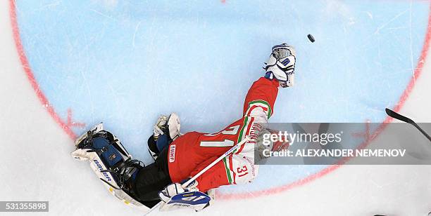 Hungary's goalie Miklos Rajna lets the puck into his net during the group B preliminary round game Hungary vs Belarus at the 2016 IIHF Ice Hockey...