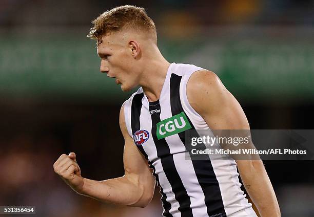 Adam Treloar of the Magpies celebrates a goal during the 2016 AFL Round 08 match between the Brisbane Lions and the Collingwood Magpies at The Gabba...