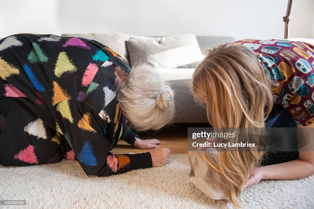 Two women looking for embroidery needle
