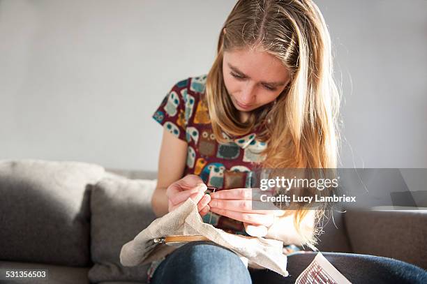 young woman embroidering - embroidery bildbanksfoton och bilder