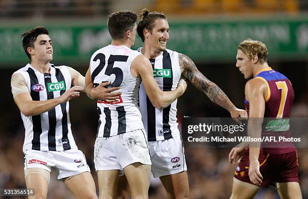 Brayden Maynard, Jack Crisp and Jesse White of the Magpies celebrate during the 2016 AFL Round 08 match between the Brisbane Lions and the...